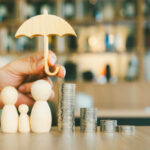Umbrella icon and family model, Security protection and health insurance. The concept of family home, protection, health care day, car insurance.